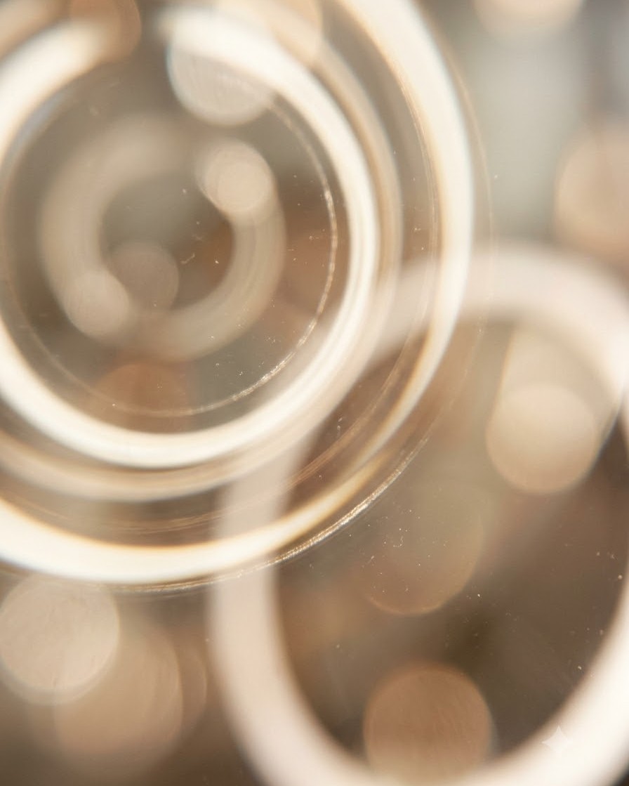 Water beads on a cold glass in bright noon heat